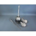 A South American white metal mate cup and straw, a button hook,