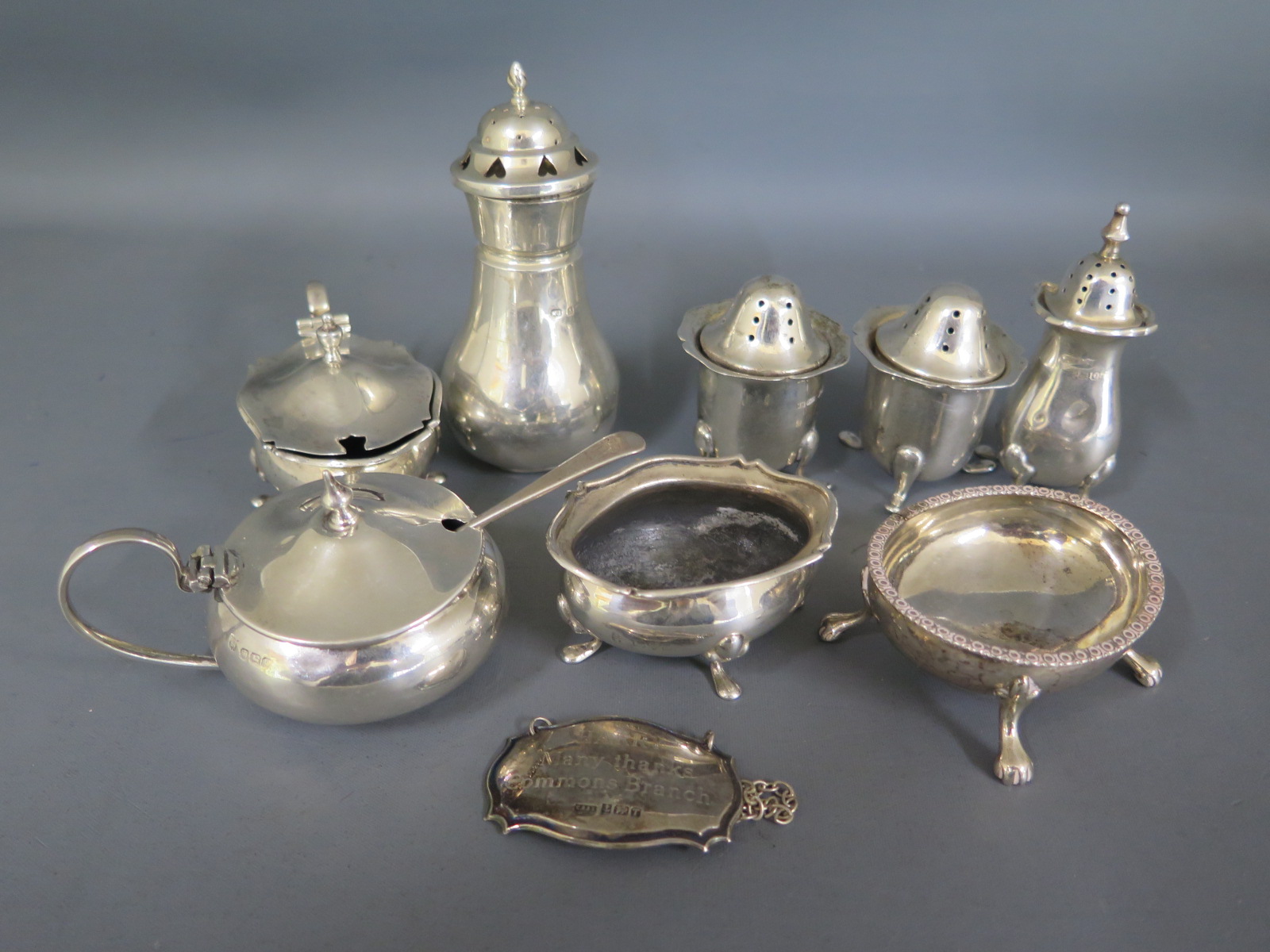 A quantity of silver hallmarked peppers, salts and mustards - Weight approx.