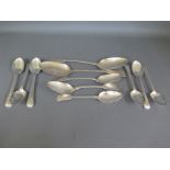 A set of six silver hallmarked spoons and four varying size fiddle back spoons,