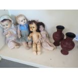 A Bisque headed doll and three composite dolls Condition report: All varying states of repair - A