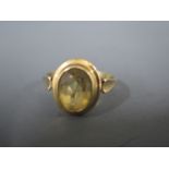 A 9ct yellow gold ring with oval cut citrine to shoulder - ring size O/P - approx weight 2.