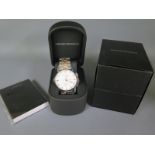 A new Emporio Armani gents wristwatch with boxes and papers