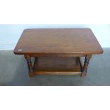 An oak refectory style coffee table with an under tier - 46cm x 56cm x 94cm