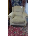 A Parker Knoll armchair with arm protectors - as new - cost £850 new