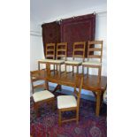 An oak refectory table with a single draw leaf and drawer and six matching chairs - Table height