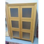 A modern light oak glazed six door cabinet by Skovby of Denmark model SM8QE - 162cm x 111cm x 48cm