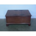 A mahogany trunk with two hinged lids raised on bracket supports - 90cm x 60cm x 45cm