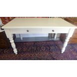 A white table with two drawers on turned legs - Width 140cm x Depth 80cm x Height 77cm