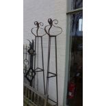 A pair of hand forged wrought iron triangular garden obelisks with scrolled finial's - Height 229cm