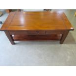 A hardwood coffee table with a single drawer - height 45cm x 60cm x 115cm