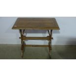 An Arts and Crafts oak and pine table - Height 69cm x 78cm x 48cm