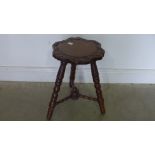 A small carved oak stool - Height 48cm