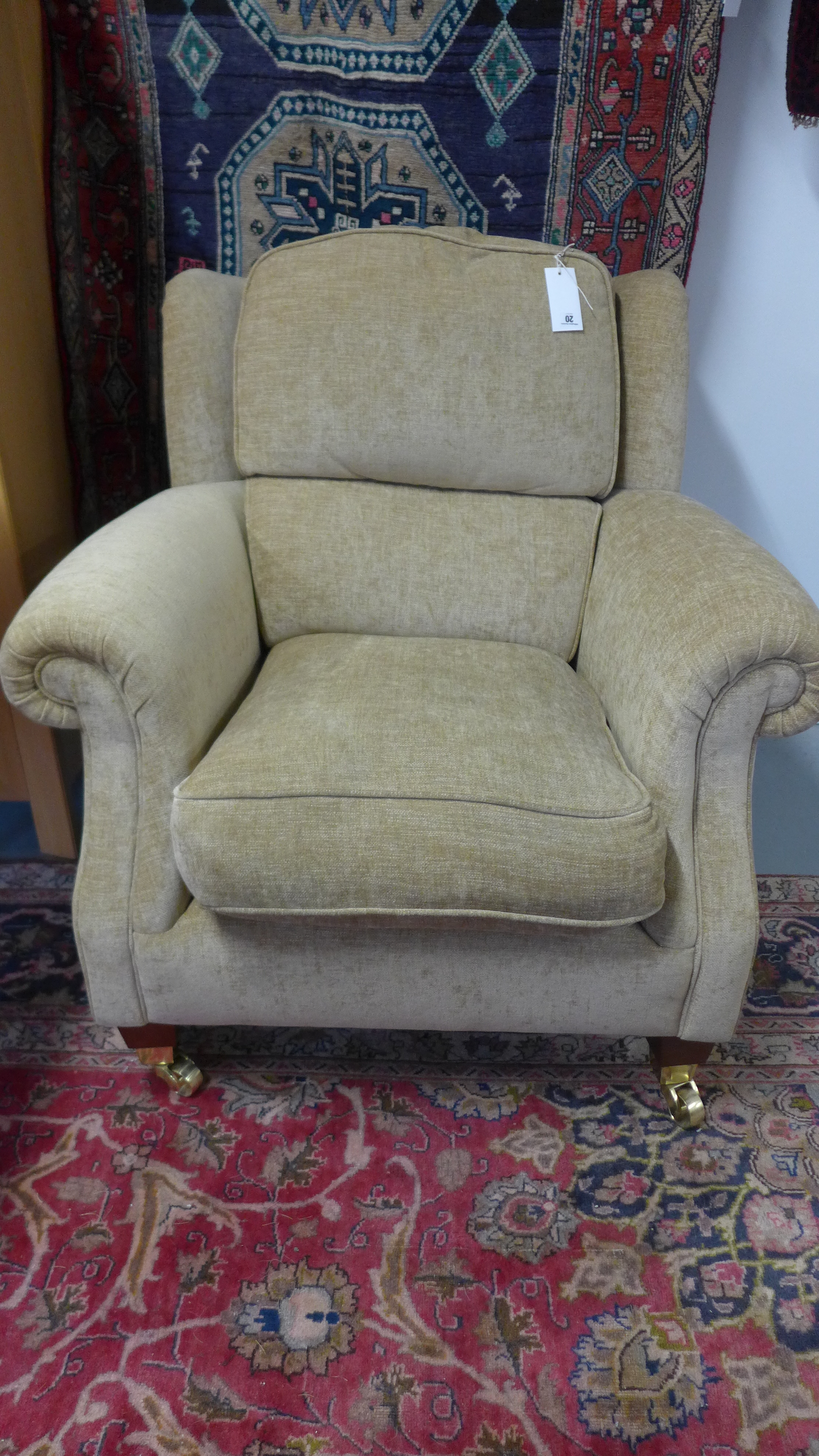 A Parker Knoll armchair with arm protectors - as new - cost £850 new