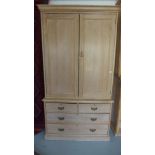 A Victorian satin birch cupboard/wardrobe above a four drawer chest now fitted with three shelves -