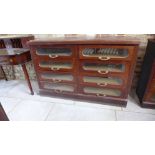 An Edwardian mahogany bank of eight haberdashery drawers - Height 93cm x 141cm x 41cm - drawer size