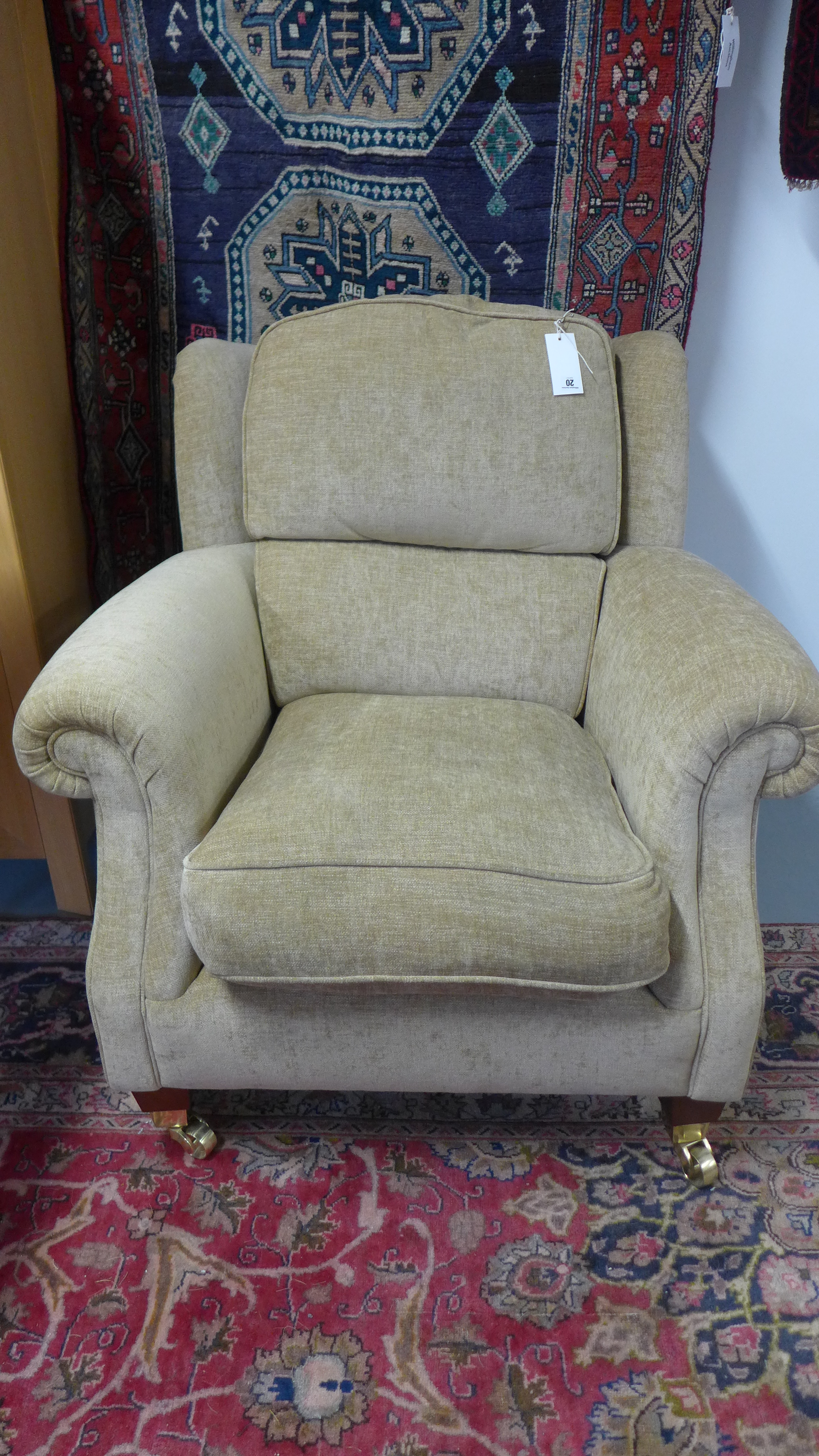 A Parker Knoll armchair with arm protectors - as new - cost £850 new