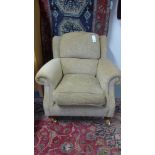 A Parker Knoll armchair with arm protectors - as new - cost £850 new