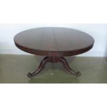 A 19th century rosewood circular topped single pedestal dining table,