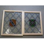 Two Edwardian Armorial stained glass windows framed and having security glass to one side - 485cm x