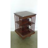 An Edwardian mahogany revolving bookcase - Height 86cm x 49cm x 49.