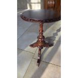 A 19th century carved mahogany wine table,