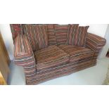 A modern two seater sofa in stripped material in good condition - Height 97cm x Width 185cm x Depth