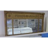 A three section giltwood framed over mantle mirror,