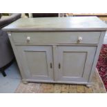 A 19th century pine two door cupboard with single drawer above, with key,