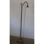 A brass standard lamp raised on three paw feet - Height 168cm