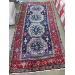 A hand knotted woolen Goochan rug - 2.50m x 1.