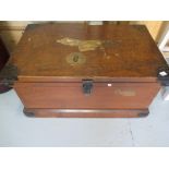 A pine travel trunk in original finish with metal edges and having various travel labels include