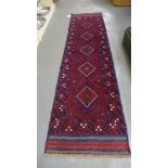 A hand knotted woolen Meshwani runner - 65cm x 249cm