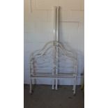 An Edwardian single iron bed with sprung base - Width 3ft 6in