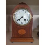 A mahogany cased 8 day mantle clock with inlay, strikes hours and half on gong,
