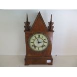 A walnut veneered cased mantle clock,