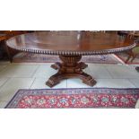 A large Jupe style circular dining table on a quatrefoil base - Diameter 147cm - extends with four