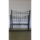 An Edwardian brass and iron 4ft 6in bedstead with side rails