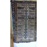 A hand knotted woolen Baluchi rug - 1.44m x 0.