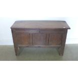 An 18th century oak coffer with a panelled front - Height 62cm x 101cm x 38cm