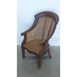 A 19th century mahogany child's chair with old repairs