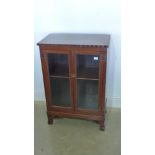 A circa 1920s oak and walnut glazed display cabinet/bookcase - Height 86cm x 58cm x 33cm