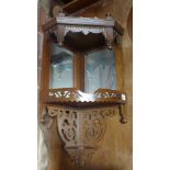 A corner wall hanging shelf with pierced decoration and mirror backed - 76cm x 27cm x 27cm