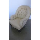 A Victorian button back armchair recently re upholstered