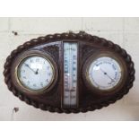 An oak cased rope twist clock/barometer and thermometer