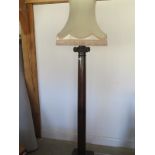 A very striking oak standard lamp in the form of a Corinthian column,