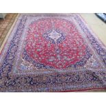 A red ground find handmade Persian Keshan carpet - 3.95m x 3.