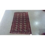 A handknotted woolen Baluchi rug - 1.24m x 0.