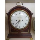 An early 20th century mahogany and lacquered bracket clock,