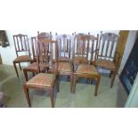 Nine oak dining chairs including a carver - 5 plus 4 - all with tartan seat covers