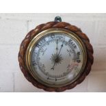 An oak rope twist aneroid barometer
